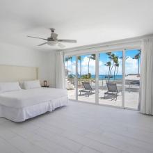 Primary bedroom 3rd floor with 1 King bed, balcony, ocean view, and ensuite bathroom