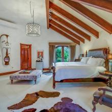 Villa de Los Sueños: 5th bedroom (2nd primary) with King bed, desk, and TV