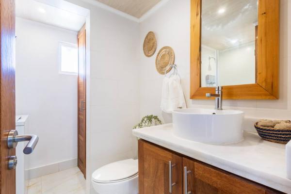 Shared bathroom includes essential amenities for convenience.