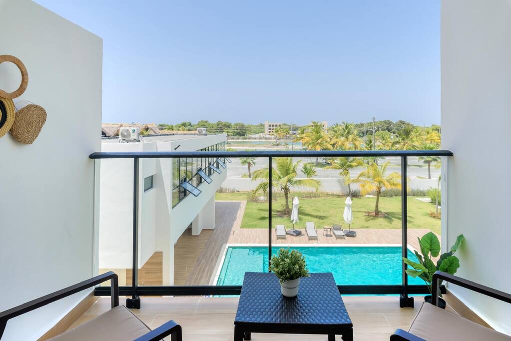 Private balcony with pool views—perfect for morning coffee or evening drinks.