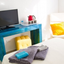 You have a flat screen TV and free Internet in the apartment.  Relax on this nice armchair and enjoy your vacation.
