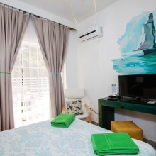 A very comfortable bed, soft pillows, sleep here like a baby. A little fridge and an electric kettle are at your disposal, right in your room. Art is in every detail of the apartment, you'll love it.