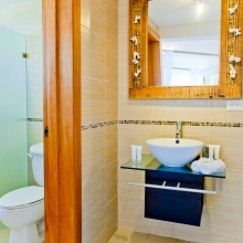  Airy and bright bathroom where you can take a shower after a long day on the beach.