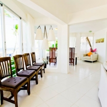 The living room is always full of sunlight and sea breeze because it is a really beachfront accommodation.