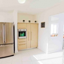 The kitchen is equipped with a large fridge for your convenience. 