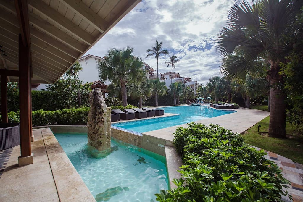 A huge swimming pool invites you to relax and enjoy your stay at this tropical paradise.