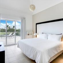 Bedroom 2 (upstairs, main house) with 1 King bed (or 2 Twin beds), TV, closet, ensuite bathroom