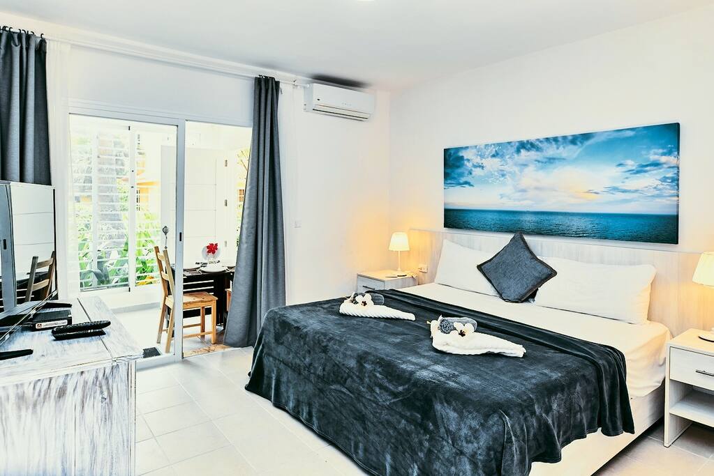 Nice bright bedroom has everything you need for a comfortable stay.
