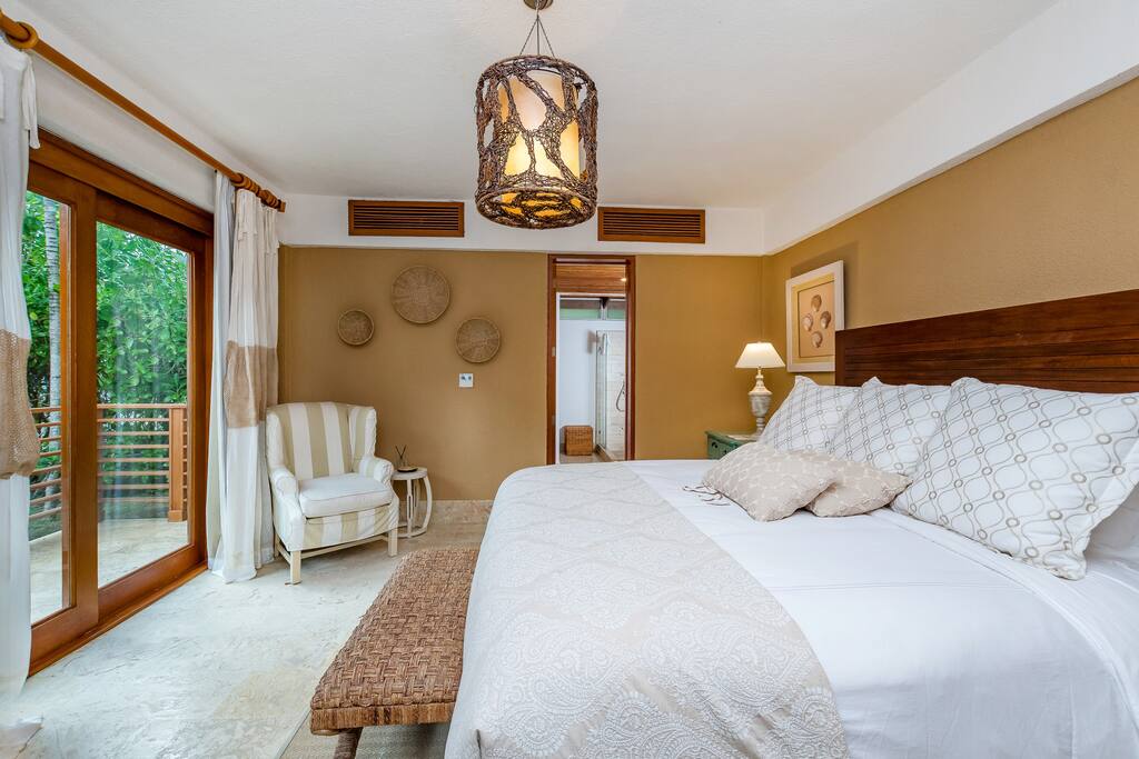 Spacious and airy bedroom with a giant bed & fresh linens for your sweet dreams.