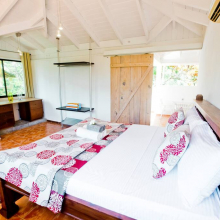 Relax in a cute air-conditioned bedroom with big windows, sleep on fresh linen. There's plenty of storage space.