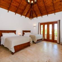 Enjoy the view of palm trees from the French balcony in the second bedroom.