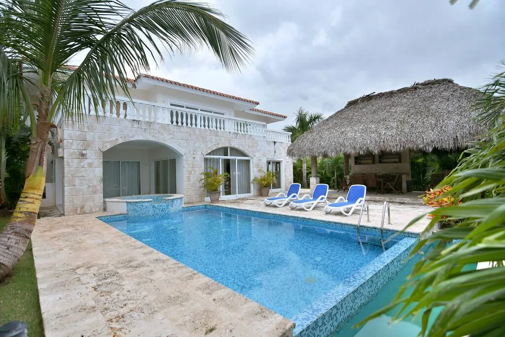 The villa has a large swimming pool and sun loungers