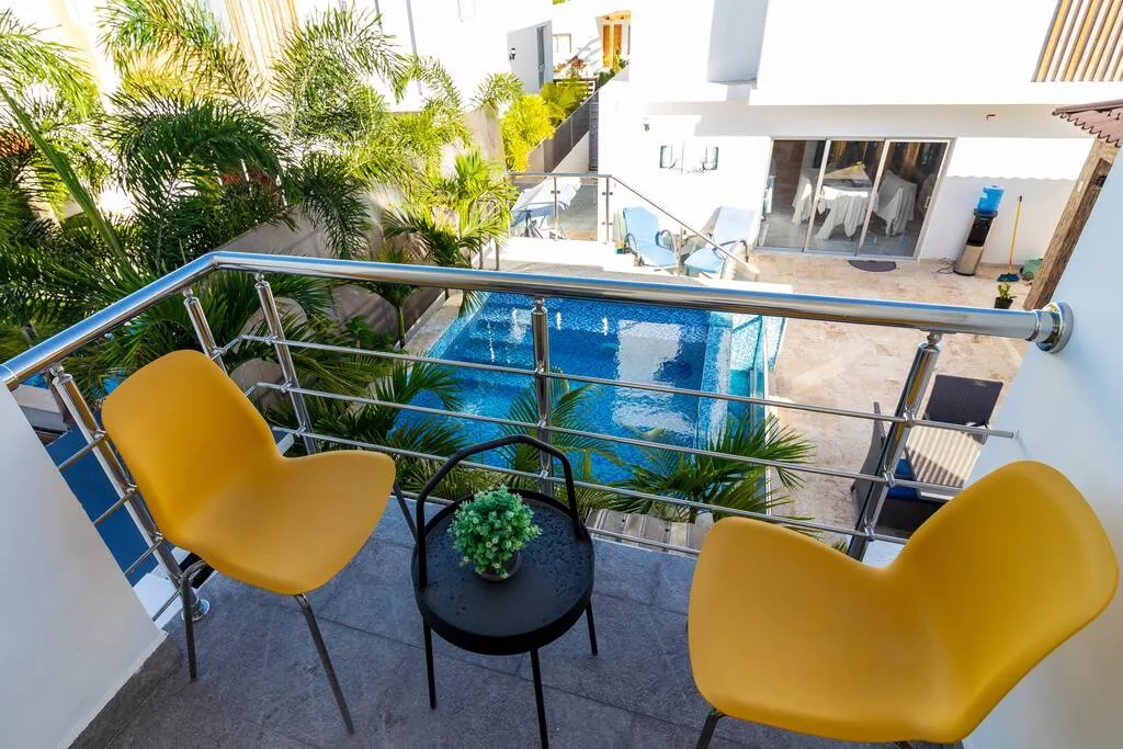 The villa's balcony overlooks the pool