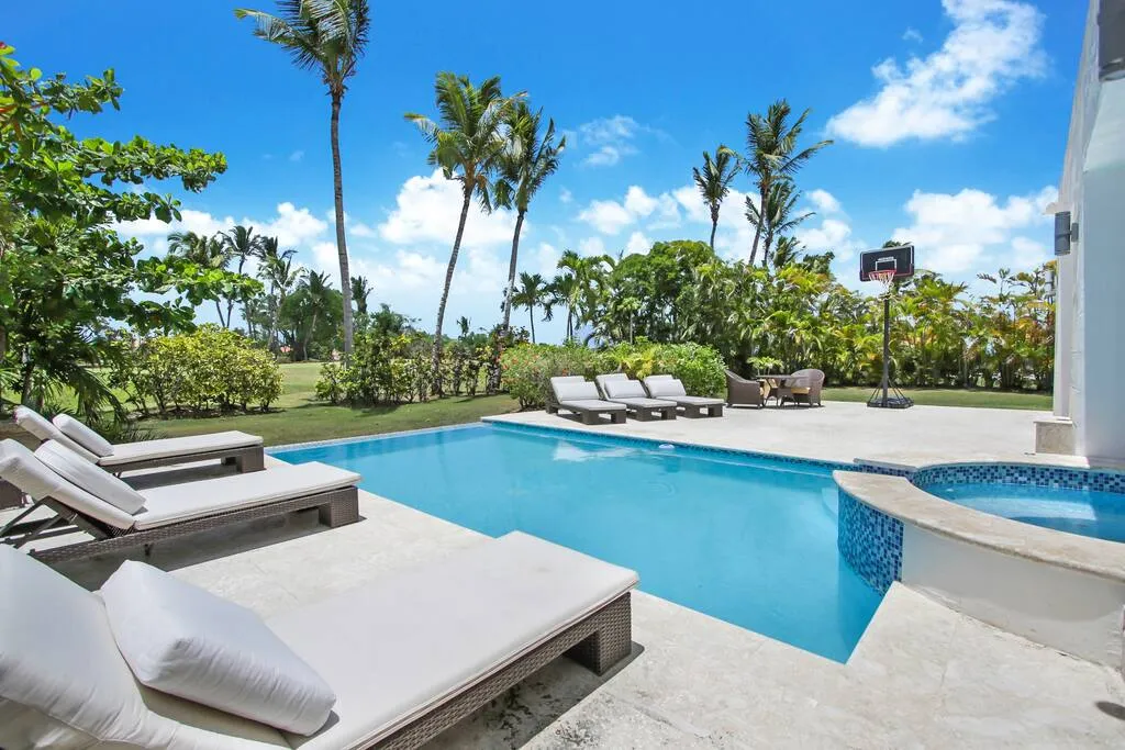 Large private swimming pool with sun loungers